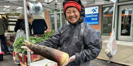 Tou Lee from Lee's One Fortune Farm holds fresh bamboo