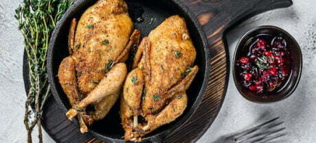 roasted quail with herbs and cranberry sauce